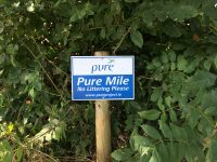 pure mile sign